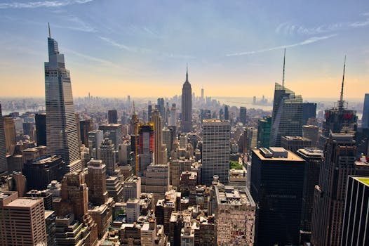A breathtaking view of New York City's skyline with the Empire State Building in the center, showcasing urban architecture.
